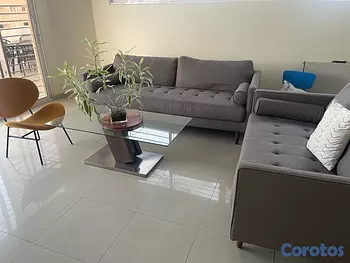 muebles y colchones - Juego de muebles gris, mesa de centro y silla naranja. 